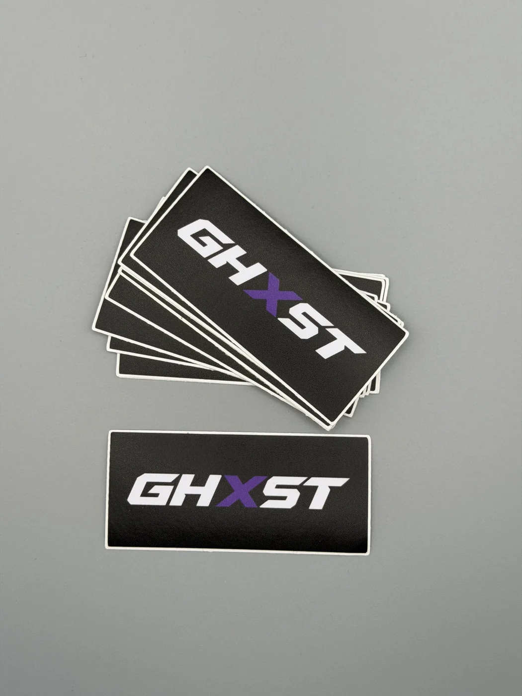Stack of black SHOP GHXST logo stickers
