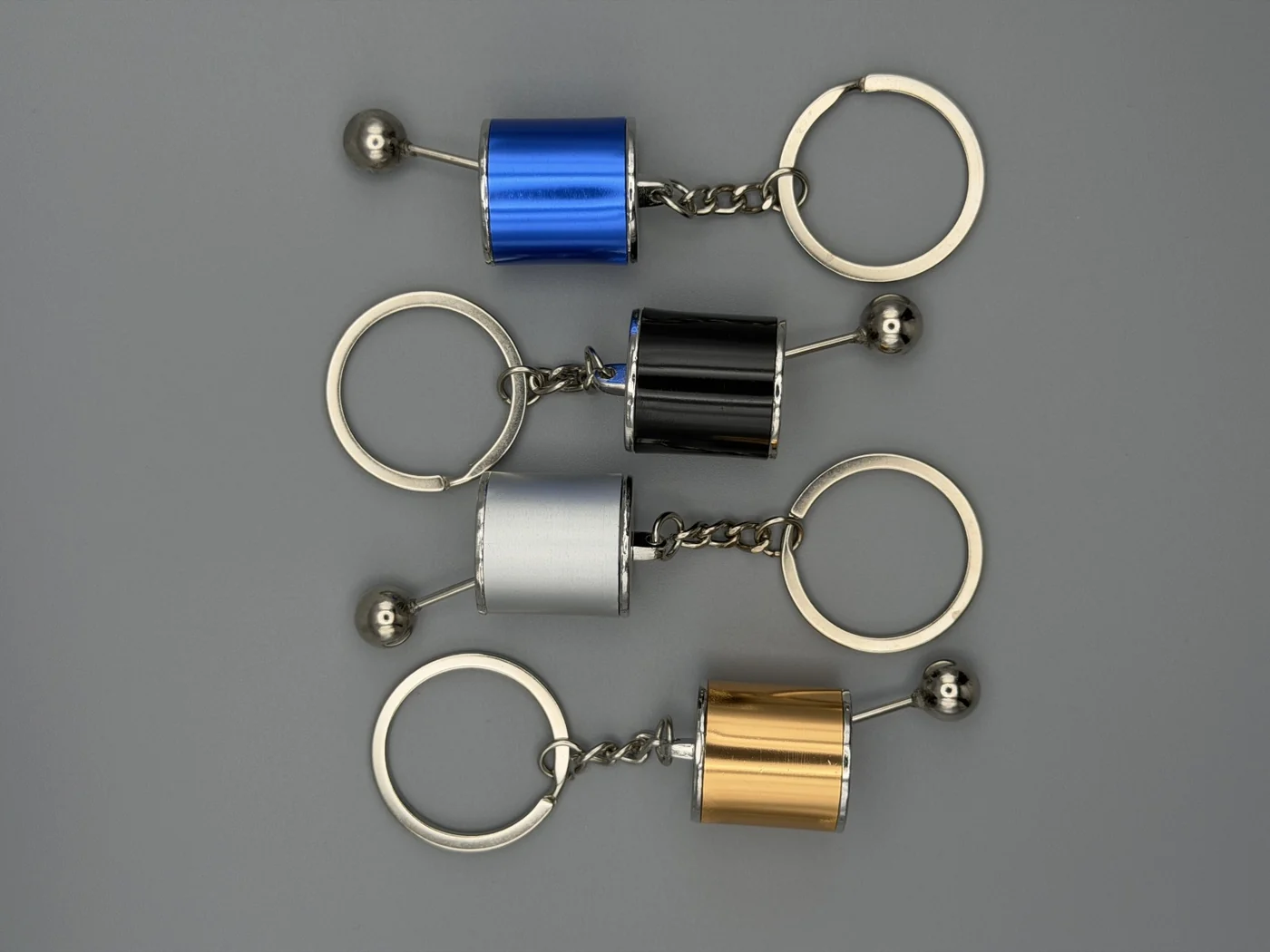All four SHOP GHXST manual shifter keychain colors