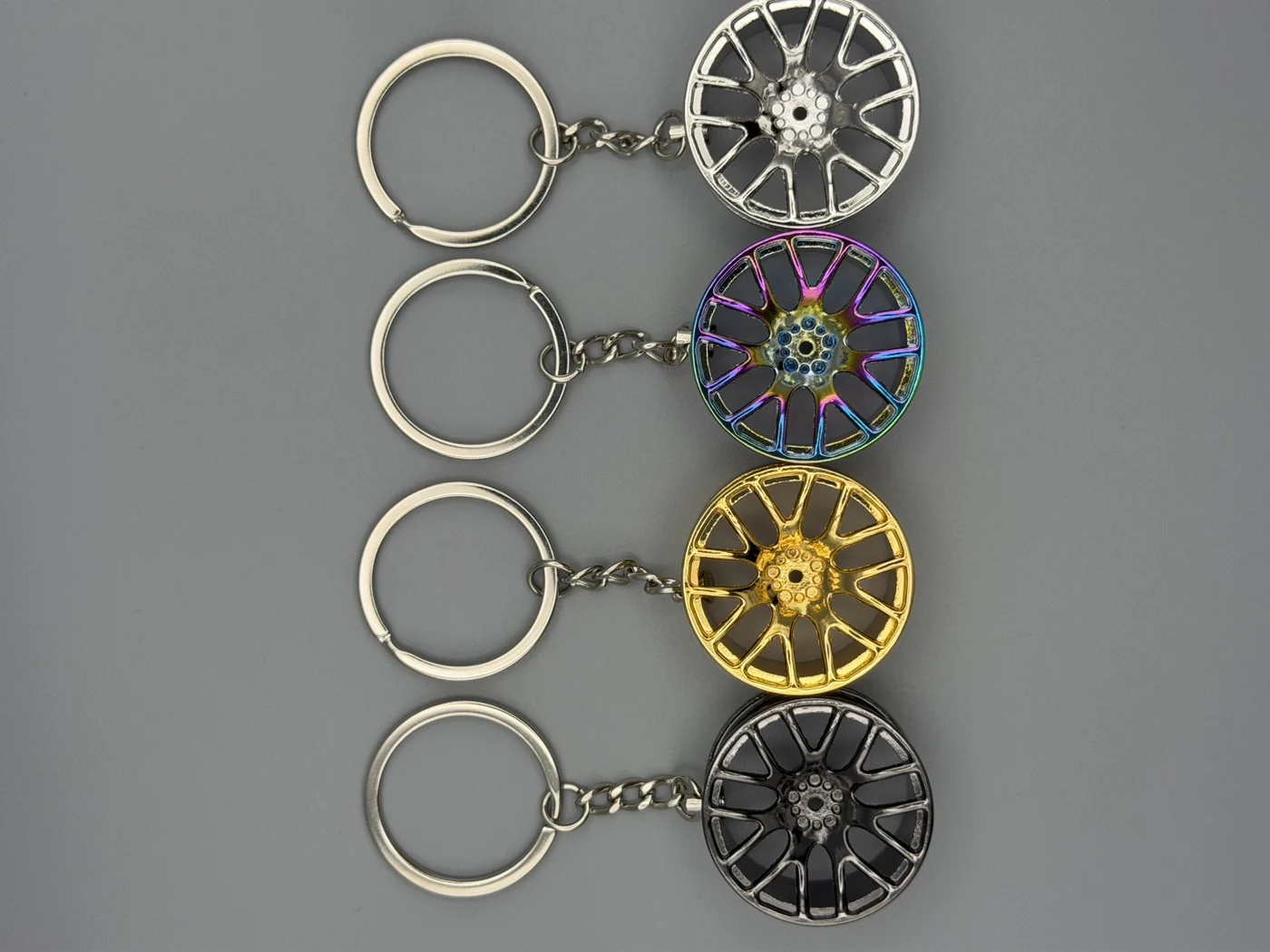 All four SHOP GHXST wheel keychain finishes